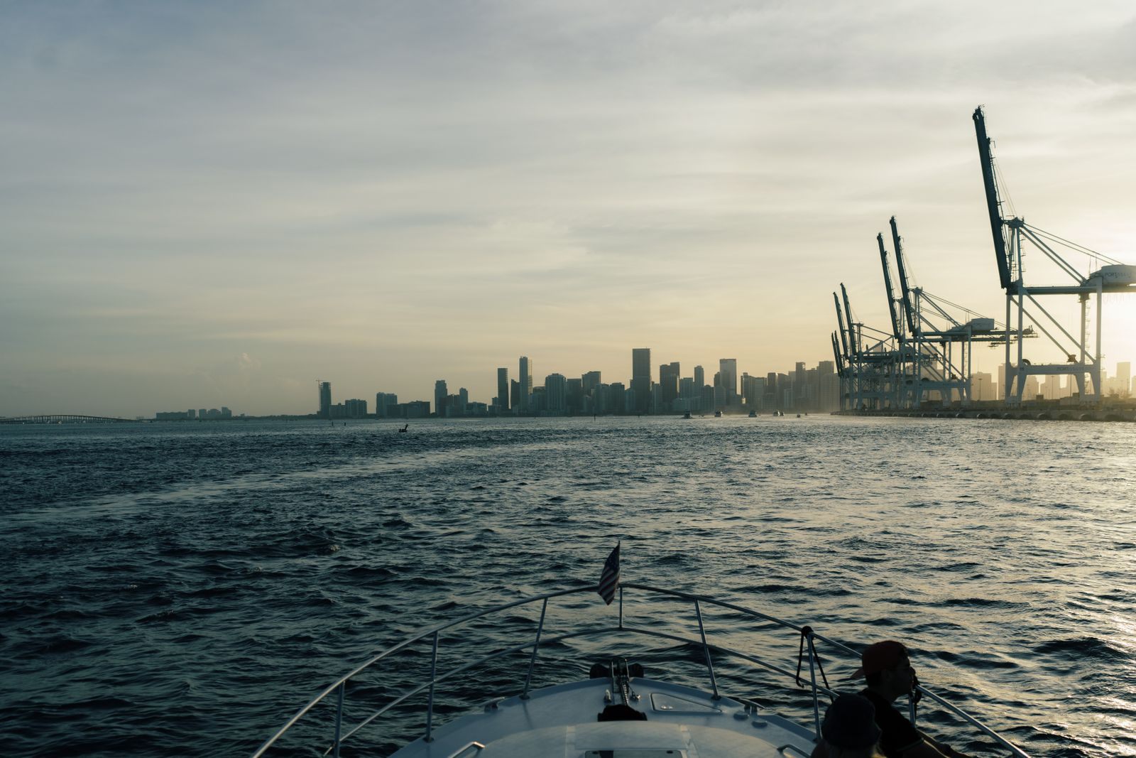 Miami skyline and port cranes seen from the water, where many cheap cruises from Florida begin